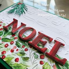 a close up of a christmas card with the word joy spelled in red on it