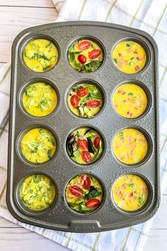 a muffin tin filled with different types of food