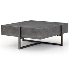 a concrete coffee table sitting on top of a metal stand with two legs and an open end