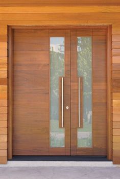 a wooden door with two glass panels on the front and side doors that are open