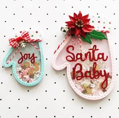 two handmade christmas ornament hanging on a wall with polka dot dots and poinsettis