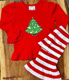 "Hi and Welcome to my store.  Thank you for stopping by to check out our cute little frill Christmas outfit.  I can add her name under the tree. Just add that at checkout in the comments to me.  The pants are stretchy so they fit well.  These shirts and pants are super soft and comfy.  Please let me know if you don't see your size. *Please note that I personalize the dresses, another company makes them.  💕 Our current production time is 5-7 days plus shipping time. If I need to order your item it will add 5 days to the process.    If you are needing a rush order please add the \"Rush My Order\" listing from my shop.  (please message me before you purchase this to make sure I have your item in stock)   https://www.etsy.com/listing/545381716/rush-my-order-1-2-day-processing-time? Thank you Cute Festive Winter Sets, Christmas Outfit For Kids Girl, Festive Winter Cotton Sets, Festive Cotton Sets For Winter, Cotton Festive Winter Sets, Festive Long Sleeve Winter Sets, Holiday Long Sleeve Cotton Sets, Cotton Long Sleeve Sets For Holiday, Holiday Long Sleeve Sets For Fall