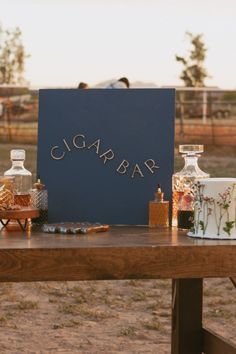 A cigar bar is the perfect way to tie in a unique and personal element into your summer outdoor wedding! Outdoor wedding ideas, backyard wedding ideas, cigar bar, wedding bar ideas, wedding bar inspiration, signature cocktail for wedding, farm wedding, wildflower wedding theme. For more unique wedding ideas check out this blog post at jaidynmichele.com Bar Ideas Wedding, Wedding Cigars, Wedding Ideas Unique, Wedding In Arizona, Wildflower Wedding Theme, Summer Wedding Ideas, Unique Wedding Ideas, Modern Western, Cute Wedding Ideas