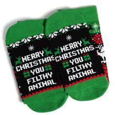 Step up your holiday sock game with these funny Christmas sweater style socks! These festive socks boast a classic Nordic sweater-style knit pattern featuring Christmas trees, presents, and a cheeky surprise if you look closely! On the bottoms, you'll find a saying that'll light up any Christmas movie buff: "Merry Christmas You Filthy Animal"! Looking for a fun stocking stuffer? These socks are the perfect gift for anyone with a great sense of humor. They'll love sporting them all season long - Ugly Sweater Contest, Nordic Sweater, Cute Christmas Outfits, Holiday Socks, Filthy Animal, Funny Christmas Sweaters, Best Stocking Stuffers, Sock Game, Sock Animals