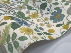 a wallpaper with flowers and leaves on it's back side, as well as the bottom half