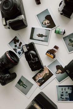 a camera and some pictures on a table