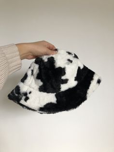 A furry cow print bucket hat. Fits most head sizes, but with an internal adjustable strap for those with smaller heads. Cow Print Bucket Hat, Bucket Hat Fits, Hat Fits, Bucket Hat Black, The Cow, Cow Print, Bucket Hat, Cow, Adjustable Straps