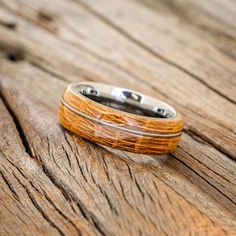 a wooden ring sitting on top of a wooden table