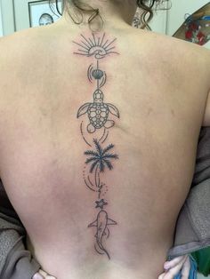 a woman with a tattoo on her back that has a turtle and palm trees in it