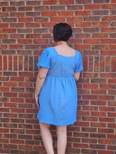 We have the PERFECT in style Spring dress for you! Our adorable babydoll square neck mini dress in blue is the perfect shade of everything you need. It's cute, flowy, and has a defined waist line with little stretch. Stay cool and look stunning. The dress also has everyone's favorite- pockets! ABOUT THIS ITEM: Made in China. Fabric is 97% Polyester / 3% Spandex. Hand Wash in Cold water. Hang or line dry. The Model is 5'6, and wearing a medium. Size chart provided in photos. Casual Blue Empire Waist Dress, Casual Blue Mini Dress With Straight Neckline, Cute Square Neck Mini Dress For Day Out, Flowy Square Neck Mini Dress For Day Out, Flowy Mini Dress With Square Neck For Day Out, Cute Blue Mini Dress With Square Neck, Blue Square Neck Sundress, Casual Blue Dress With Straight Neckline, Light Blue Square Neck Dress For Day Out