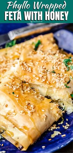 a blue plate topped with food covered in sesame seeds