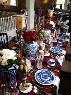 the table is set with blue and white dishes