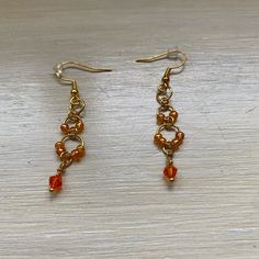 Orange Glass Seed Beads Hang On Gold Rings To Create These Unique Earrings! Hypoallergenic Gold Hooks Ensure Ear Comfort. Handmade In A Smoke-Free And Pet-Friendly Home Strawberry Bead Earrings, Elegant Seed Bead Earrings, Orange Earrings With Gold Beads As A Gift, Orange Earrings With Gold Beads For Gift, Orange Faceted Beads Earrings For Gifts, Orange Beaded Earrings With Gold Round Beads, Orange Faceted Beaded Earrings For Gift, Thanksgiving Earrings, Rasta Earrings