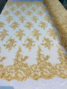 a white table with gold lace on it