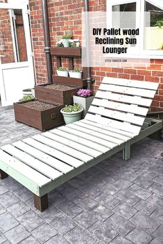 an outdoor lounge chair made out of pallet wood and reclining sun lounger