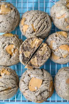 cookies with peanut butter and chocolate chips are on a cooling rack, ready to be eaten