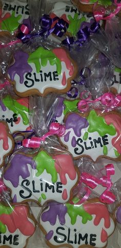 some decorated cookies with the words slime, slime and slime on them