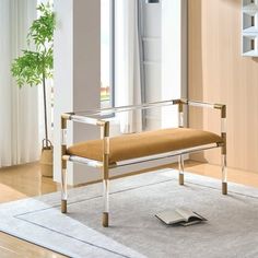 a bench sitting on top of a rug in a living room next to a window