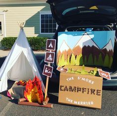 there is a campfire sign next to the trunk of a car