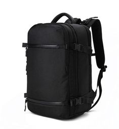 a black backpack with straps on the front and back sides, sitting against a white background