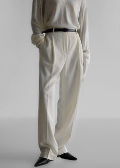 Color: Cream Lightweight suiting fabric Relaxed fit Straight leg Low rise Single pleat front detailing Side seam pockets Illusion back welt pockets Fold at hem Zip fly Hook and bar closure Unlined 96% Polyester 4% Elastane Dry Clean By The Frankie Shop. Imported White Pants With Pressed Crease For Work, White Wide Leg Pants With Welt Pockets For Work, White Wide Leg Pants With Pressed Crease For Work, White Pressed Crease Pants For Work, Chic Wide Leg Pants With Welt Pockets For Tailoring, Chic Wide Leg Pants With Welt Pockets, Timeless Wide Leg Workwear Pants, Chic Bottoms With Welt Pockets For Workwear, Chic Wide Leg Dress Pants With Concealed Placket