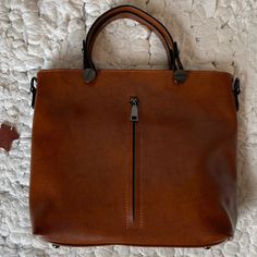 Genuine Cowhide Leather Tote Bag, Brown, Black Hardware, Top Zipper Closure, Hardware And Leather Shoulder Strap, Interior Fabric Lining, Exterior And Interior Zipper Pockets, Nwot Measurement Aprox: W 12 X H 11 X D 4” Brown Handheld Shoulder Bag With Zipper Closure, Brown Handheld Shoulder Bag With Zipper, Handheld Brown Shoulder Bag With Zipper Closure, Handheld Brown Shoulder Bag With Zipper, Brown Hobo Bag With Zipper Closure For Shopping, Brown Hobo Bag With Zipper For Shopping, Brown Canvas Satchel With Zipper Closure, Brown Satchel Shoulder Bag With Zipper Closure, Brown Satchel With Zipper Pocket For Errands