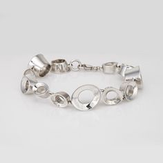 This is part of Chairish’s Costume Jewelry assortment.  Stylish estate Tiffany & Co Frank Gehry Morph bracelet crafted in sterling silver (circa 2006-2012).    The chunky bracelet is a Tiffany classic, with thick oval links designed by the famed Frank Gehry. No longer available for sale at Tiffany & Co, the retired Tiffany bracelet weighs 48 grams has a hefty, solid feel on the wrist. The bracelet is great worn alone or layered with your fine jewelry from any era.   The bracelet is in good condi Modern Polished Sterling Silver Bracelet, Modern Sterling Silver Bracelet With Oval Link Oyster, Sterling Silver Oyster Bracelet With Oval Links, Modern Silver Hallmarked Bracelet, Contemporary Sterling Silver Bracelet, Contemporary Sterling Silver Bracelet In Silver, Oval Sterling Silver Jubilee Bracelet, Modern Oval Link Sterling Silver Bracelets, Modern Oval Bracelets With Polished Finish