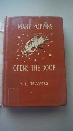 an old red book with the title mary poppinss opens the door on it