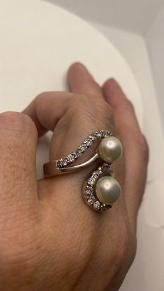 Vintage pearl cocktail ring Lovely 925 sterling silver set with white Pearl set in very detailed vintage filigree tarnished from age. Size 8 My jeweler can re size for a $10-$20 fee All rings are shipped free in the US in a nice gift box. Check out our over a THOUSAND great reviews!!! Engraving is $4 per letter and is not always perfect depending on the piece. It can take a few days if the jeweler is busy. This is payable to Paypal Judithsltd@gmail.com Vintage Pearl Ring As Gift, Vintage Pearl Rings As Gift, Elegant 925 Stamped Pearl Promise Ring, Silver Open Pearl Ring For Anniversary, Silver Pearl Open Ring Jewelry, Classic Silver Pearl Ring For Formal Occasions, Vintage Pearl White Jewelry For Anniversary, Sterling Silver Open Ring Pearl Ring For Formal Occasions, Sterling Silver Open Ring Pearl Ring For Formal Events