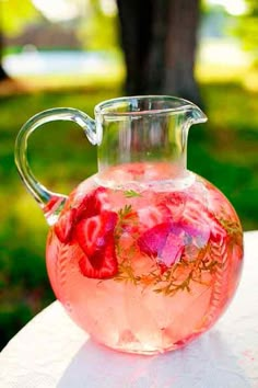 a pitcher filled with liquid sitting on top of a table