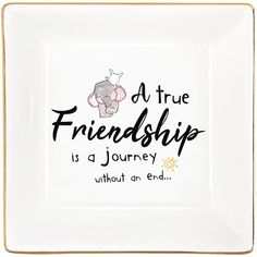 a white square plate with an elephant saying at true friendship is a journey without an end