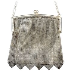 Silver mesh bag in its color decorated with triangular elements on the bottom that has a smooth closure by hinges and a chain of alternating long and short links. This type of pieces were very frequent in the 19th century, as a luxury element and a practical piece for galas and other special events. Weight: 187 gr" Size: 15 x 15 cms. Depth is orientative. Elegant Evening Shoulder Bag With Chainmail, Elegant Chainmail Bag, Elegant Silver Bag With Chainmail Detail, Elegant Silver Chainmail Bag, Rectangular Chainmail Evening Bag, Rectangular Evening Bag With Chainmail, Evening Rectangular Chainmail Bag, Silver Snake Bracelet, Serpent Jewelry