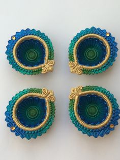 four pieces of blue and green glass with gold trim