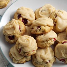 a white plate topped with cookies covered in frosting