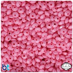 pink plastic beads with holes in the middle