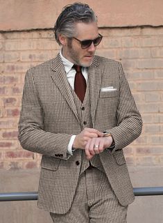 For your most important event, you demand excellent attire to make the occasion far more supreme. Crafted with wool, our Houndstooth Brown Tweed Suit is designed with a houndstooth pattern that looks like small broken squares and brown color will capture your perfect depiction to the world and it also gives comfort at every wear. So grab this very elegant suit that will make you look lavish on your day.  Look Includes   Houndstooth Brown Tweed Fabric  Two Button Jacket Style  Notch Lapel  Horn Brown Buttons  Single Vent  Three Cuff Buttons  Two Welted Back Pockets on Trousers    Click 'Customize Now' to modify the look if needed.   Lining: Viscose; Dry Clean. Brown Tweed Suit, Elegant Suit, Tweed Suit, Elegant Jacket, Brown Tweed, Tweed Suits, Wool Crafts, Button Jacket, Tweed Fabric