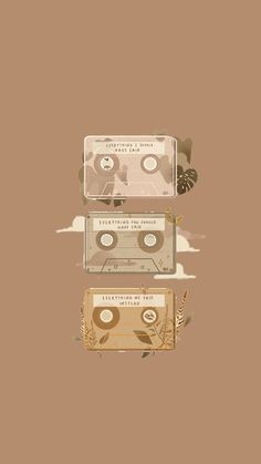 two cassettes sitting on top of each other in front of a brown background with leaves