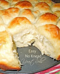 a cake that has been cut in half and is on a plate with the words easy no knead yeast bread