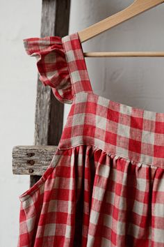 Victorian style inspired pinafore dress with flutter sleeve made from 100% soft and washed Oeko-Tex certified linen Details: - Composition: 100% Oeko-Tex certified linen - Colour: red check - Coconut buttons down the back - Size: XS-S, M, L-XL - Medium weight linen - Linen care: machine wash gentle; tumble dry low, ironing optional - The price is for one pinafore dress, other pictured items are not included Check Dresses For Women, Dress With Wings, Vintage Prairie Dress, Homemade Dress, Dress With Flutter Sleeves, Gingham Linen, Linen Dress Women, Dress Linen, Check Dress