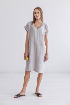 "DESCRIPTION: ♥ 100% natural European linen; ♥ safe Oeko-TEX® Standard 100 certified linen fabric ♥ softened midweight linen (185 g/m2) ♥ short sleeves FIT ♥ length from the lower to the upper seam is about 39.7 inches / 101 cm ♥ measurements taken from a size S ♥ model is 173 cm and wearing a size S SIZE CHART: XS: Bust 30.7\"- 32.7\" (78-83 cm) , Waist 23.6\"- 25.6\" (60-65 cm), Hips 33.5\"- 35\" (85-89 cm) S: Bust 33\"- 35\" (84-89 cm) , Waist 26\"- 28\" (66-71 cm), Hips 35.5\"- 37.4\" (90-95 Spring Short Sleeve Flax Linen Dress, Spring Linen Dress In Flax Color With Short Sleeves, Summer Linen Midi Dress Relaxed Fit, Casual Flax Short Sleeve Dress, Short Sleeve Linen Midi Dress For Spring, Spring Linen Midi Dress With Short Sleeves, Summer Linen Dress With Short Sleeves And Relaxed Fit, Summer Linen Dress With Relaxed Fit And Short Sleeves, Relaxed Fit V-neck Linen Dress