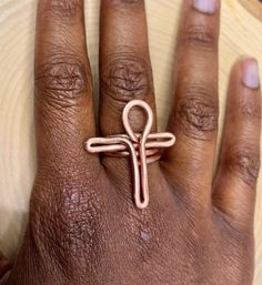 Gorgeous bare copper Ankh ring. Hand made and hand polished. Lightweight bright and smooth.  Each ring is made with beautiful light orange toned thick bare copper wire made from Peru.  Multiple sizes available- This ring is made to order and it may take up to 14 days to recive it. (3-5 days is the usual)  Comes with a free jewelry cleaning cloth. If you would like your ring oxidized for FREE, please send me a message before or right after making your order! Oxidizing will enhance your rings copp Adjustable Copper Spiritual Rings, Adjustable Copper Nickel-free Rings, Unique Handmade Copper Rings, Adjustable Nickel-free Copper Ring, Handmade Copper Artisan Ring, Bohemian Hand Wrapped Copper Wire Rings, Handmade Bronze Midi Rings, Bohemian Copper Rings For Gifts, Bohemian Copper Rings As Gifts