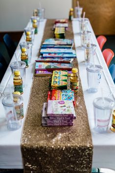 a long table with books and glasses on it