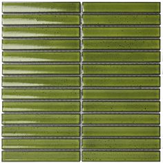 a green tile wall with silver lines on it