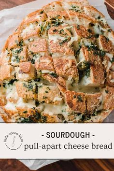 a cheesy bread with spinach and cheese on top is shown in the foreground