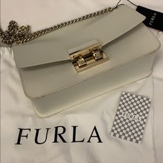 Furla Saffiano Off White New! Gorgeous Off White Furla Bag With Chain Handle. Very Sharp. Nice Color , Good For Summer Or Winter. Great Size 12x 7 X 3 . Feel Free To Ask Questions Luxury White Saffiano Leather Shoulder Bag, White Saffiano Leather Office Bag, Formal Saffiano Leather Bag With Chain Strap, Everyday Saffiano Leather Bag With Chain Strap, Saffiano Leather Bags With Chain Strap For Everyday Use, White Saffiano Leather Rectangular Bag, White Saffiano Leather Evening Bag, Evening White Saffiano Leather Bag, Gold Saffiano Leather Shoulder Bag For Evening