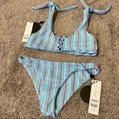 Brand: Amuse Society Bnwt Material: 79% Nylon, 21% Spandex Size: Xs On Both The Top & Bottoms Bottoms Are A Cheeky Cut. Top Has Straps That Tie For An Adjustable Length. The Middle Of The Top Has A Cute Cutout. The Stripes Are Beautiful!! 50% Off.. Bikini Top = $39.50 Bikini Bottoms = $29.00 Set = $68.50 (My Price=$65) Trendy Swimwear For Sunbathing, Trendy Striped Swimwear For Vacation, Trendy Blue Swimwear For Pool, Trendy Blue Swimwear For Sunbathing, Trendy Striped Swimwear For Beach Season, Trendy Blue Swimwear, Trendy Blue Swimwear For Poolside, Trendy Fitted Swimwear With Tie-side Bottom, Trendy Blue Stretch Swimwear