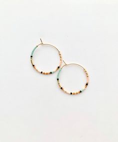 Colorful beaded hoop earrings on gold plated hoops. Very light weight. Made with very high quality Japanese beads that are perfect cylinders - for a seamless look. Size: 3 cm / 1.25 inch hoops. 🌎 Packaging 🌎 To be environmentally responsible about packaging we will package orders together in the same box. If certain items in your order are intended as gifts and you'd like individual boxes, please leave a note during checkout. Thank you for visiting and don't hesitate to message should you need Package Orders, Japanese Beads, Handmade Jewelry Earrings, Earrings Colorful, Gold Bead Necklace, Earrings Inspiration, Earrings Hoop, Beaded Bracelets Diy, Beaded Hoop Earrings