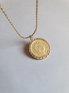 Solid gold coin necklace, gold coin pendant necklace, antique necklace, British coin gold necklace, 14k gold necklace Solid gold 14k necklace with an old british gold coin pendant, great for everyday wear, unique and beautiful. The chain is made of 14k solid gold and available in a few styles and lengths and the pendant is an original coin which I decorate with twisted gold wires and is available in 9k or 14k solid gold. Dimensions: The coin pendant's diameter is about 0.75 inch (2 cm). There ar Vintage Yellow Gold Tarnish Resistant Medallion Necklace, Vintage Yellow Gold Tarnish-resistant Medallion Necklace, Vintage Yellow Gold Coin Necklace, Tarnish Resistant, 14k Gold Necklace With Coin Pendant, 14k Gold Necklace With Round Coin Pendant, Classic Yellow Gold Medallion Necklace With Coin Pendant, Classic 14k Gold Medallion Coin Necklace, Vintage Coin Necklace With Tarnish Resistant Round Pendant, 14k Yellow Gold Necklace With Coin Pendant