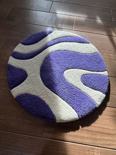 a blue and white rug is on the floor