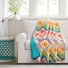 Show off your boho side with this bright and bold throw blanket. The chevron pattern is packed with brilliant designs of dazzling colors. This throw is sure to be the centerpiece of your bedroom. It pairs great with other bohemian-chic inspired decor but also works well mixed with classic, modern, contemporary and transitional design styles. It measures 50 inches by 60 inches making it ideal for single use. This throw blanket is OEKO-TEX® Standard 100 certified, which means the fabric, dyes and Transitional Design Style, Boho Quilt, Lush Decor, Cotton Throw Blanket, Bohemian Colors, Pet Crate, Boho Geometric, Cotton Blanket, Cotton Throw